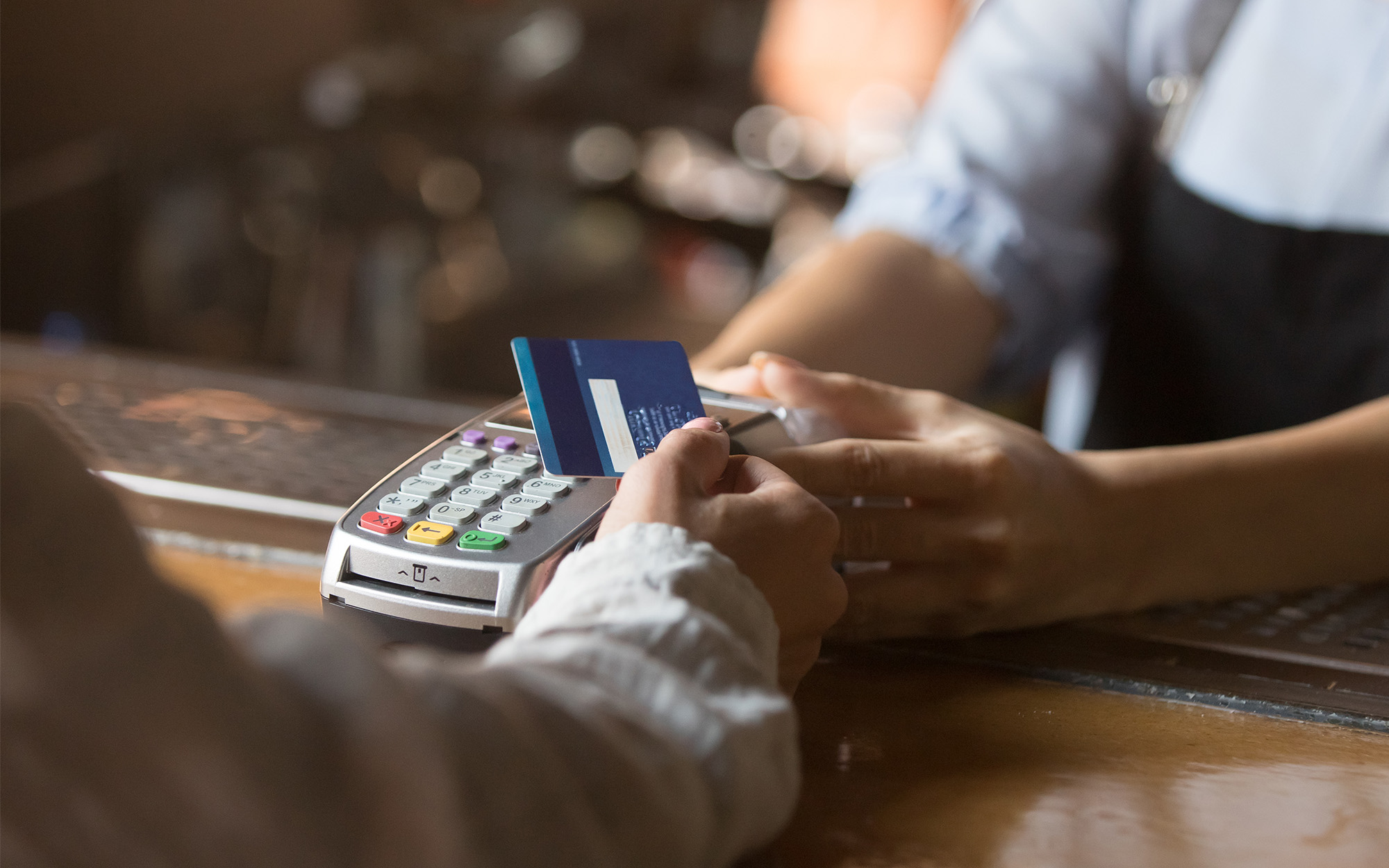 Person using card to make payment